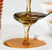 Foto de uma colher com mel